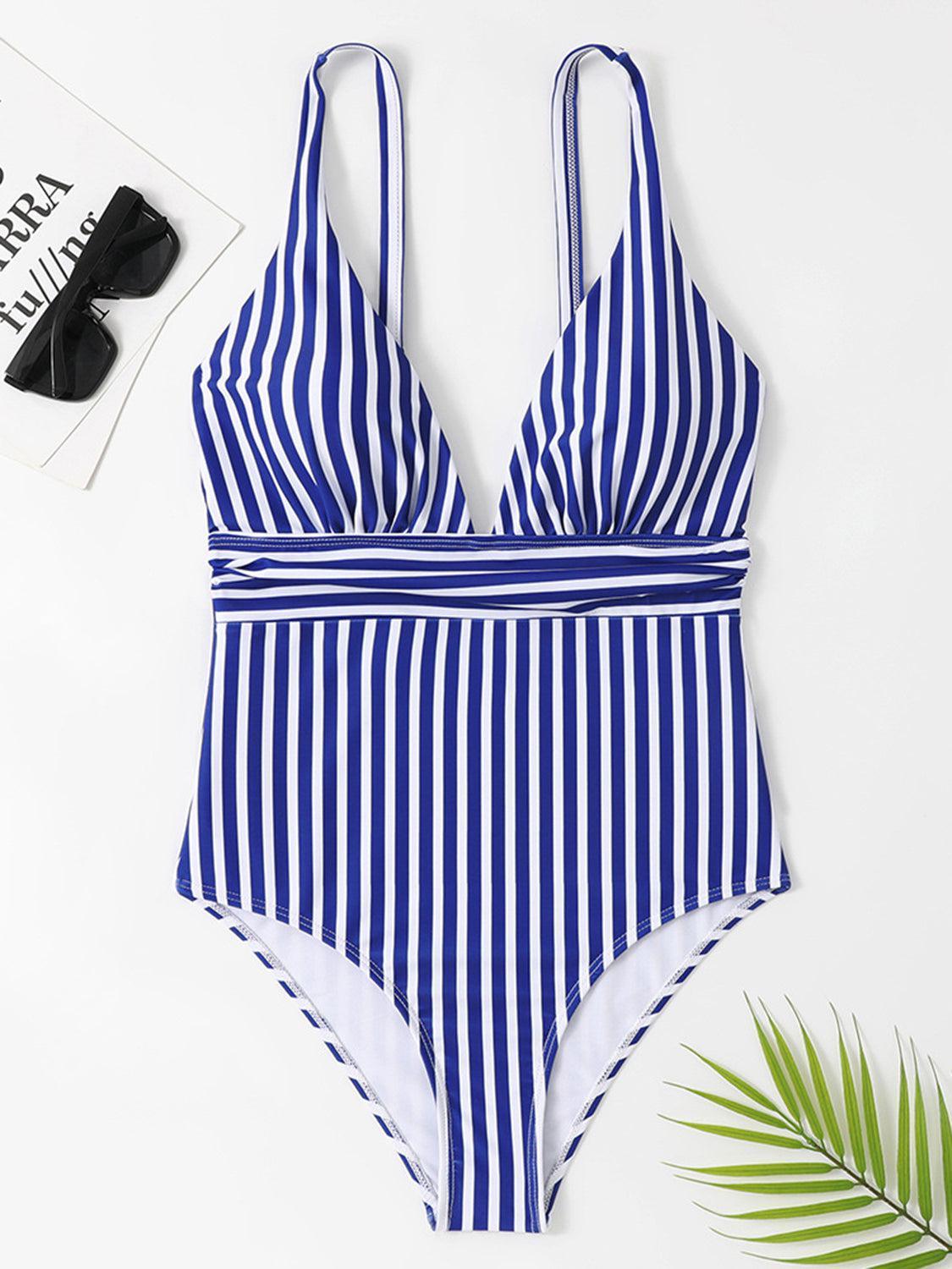 a blue and white striped one piece swimsuit