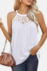 a woman in a white top holding a purse