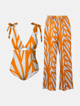 an orange and white swimsuit and matching pants