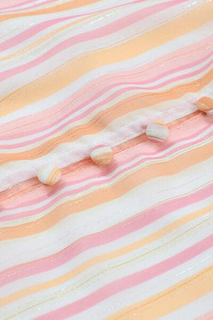 a close up of a pink and yellow striped shirt