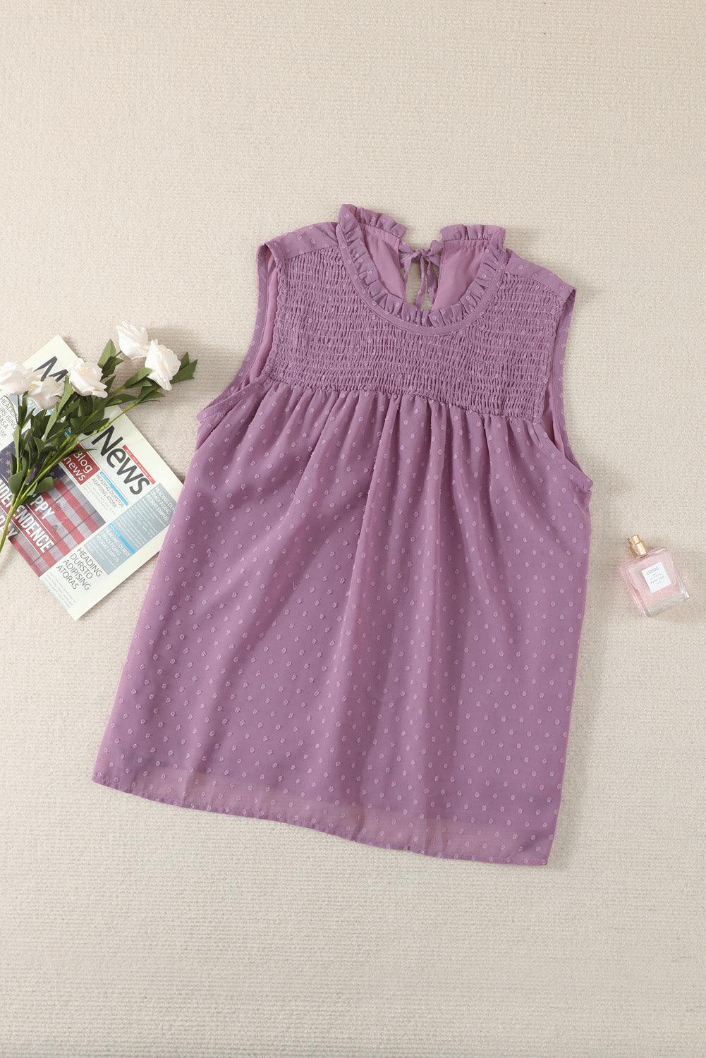 a little girl's dress and flowers on a bed