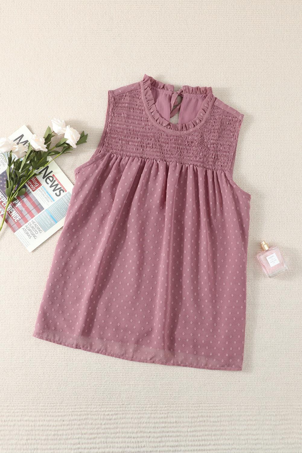 a baby girl's pink dress with white polka dots