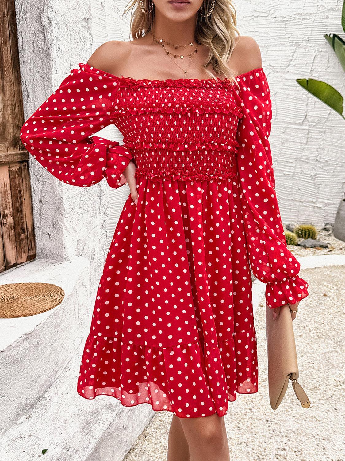 a woman wearing a red and white polka dot dress