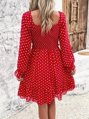 a woman in a red polka dot dress