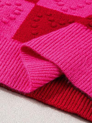 a close up of a pink and red blanket