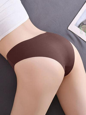 a woman laying on top of a bed wearing a brown panties