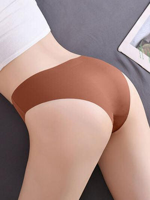a woman laying on top of a bed wearing a brown panties