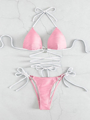 a pink bikinisuit with a tie around the bottom
