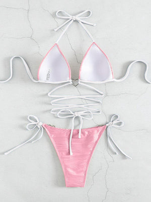 a pink and white bikini top with ties