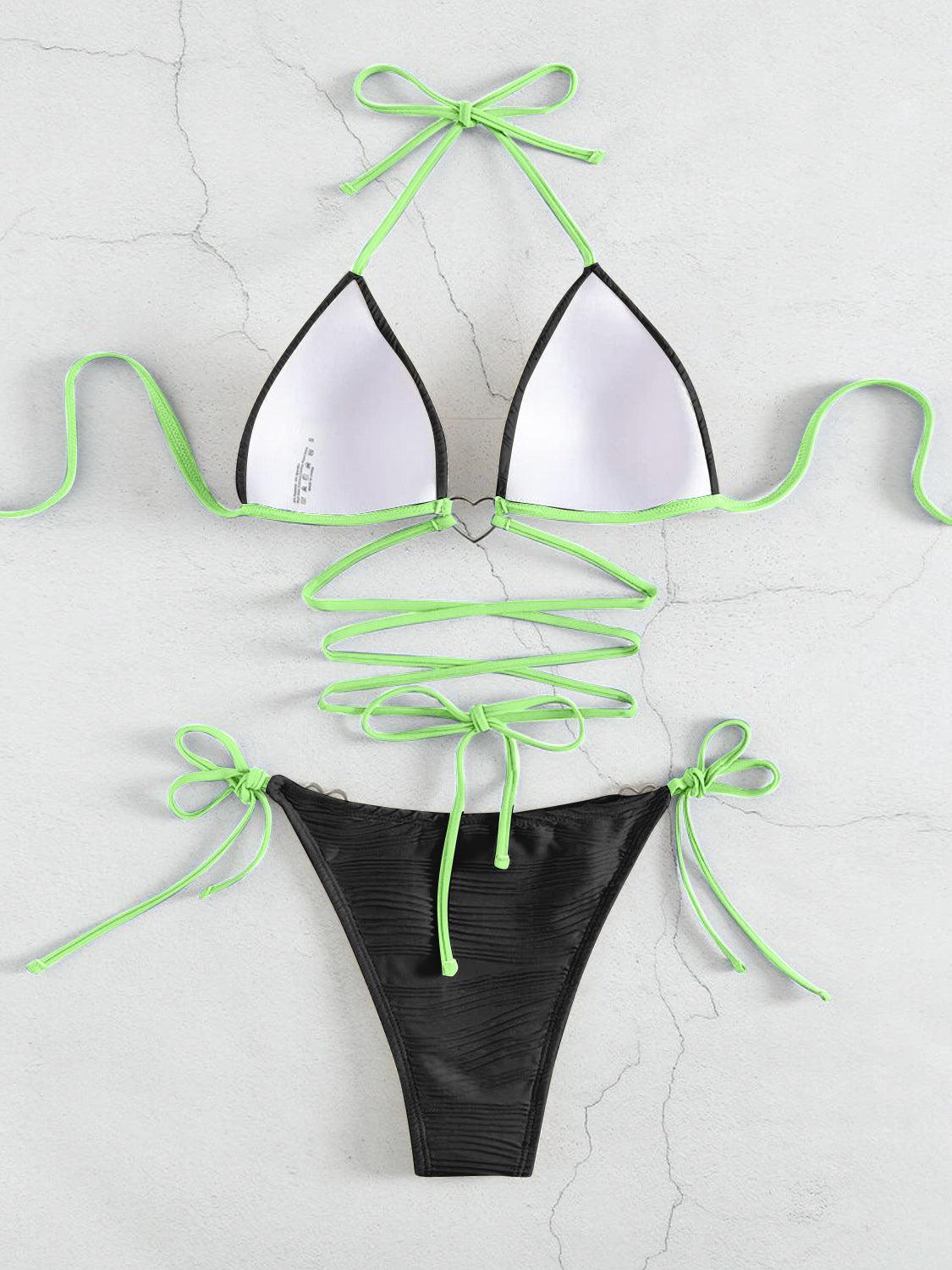 a bikini top with green string tied around it
