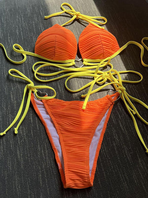 a bikini with yellow string attached to it