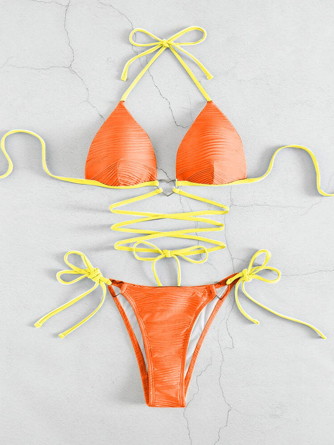 a bikini top with yellow string attached to it