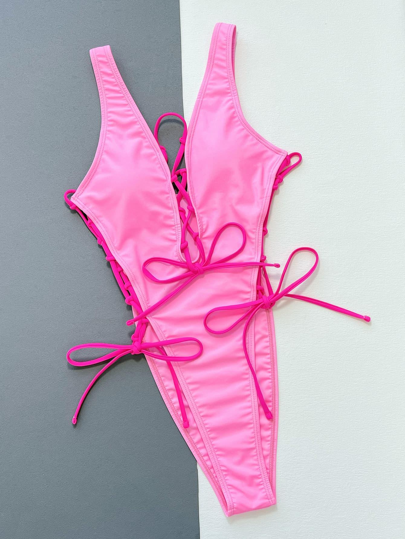 a woman's pink bikini top with pink laces