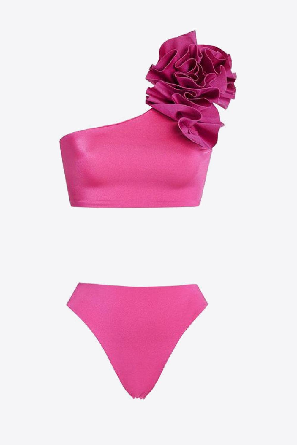 a bikini top and bottom with a flower on it