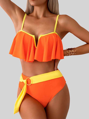 a woman in an orange and yellow bikini top