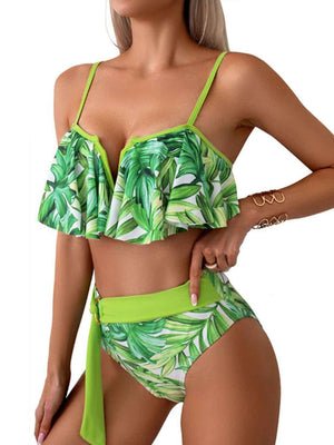 a woman wearing a green bikini top and matching bottom
