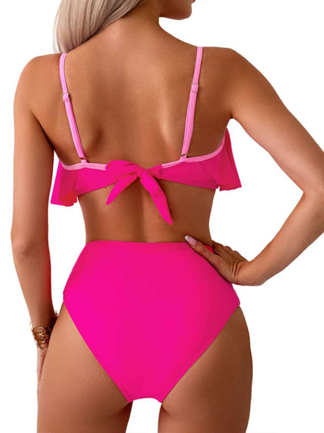 a woman in a pink bikini top and bottom