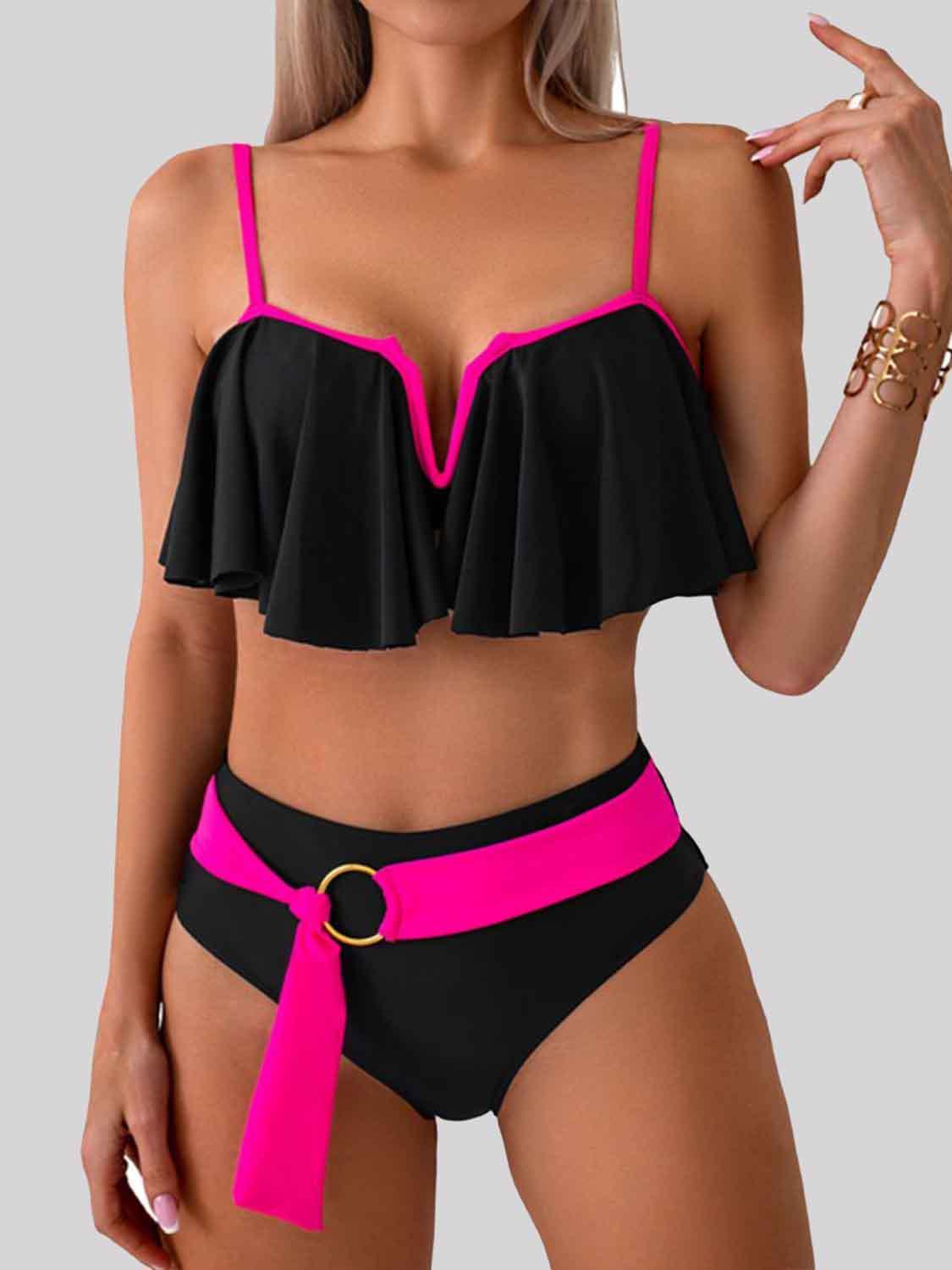 a woman in a black and pink bikini top