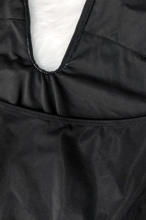 a close up of a person wearing a black jacket