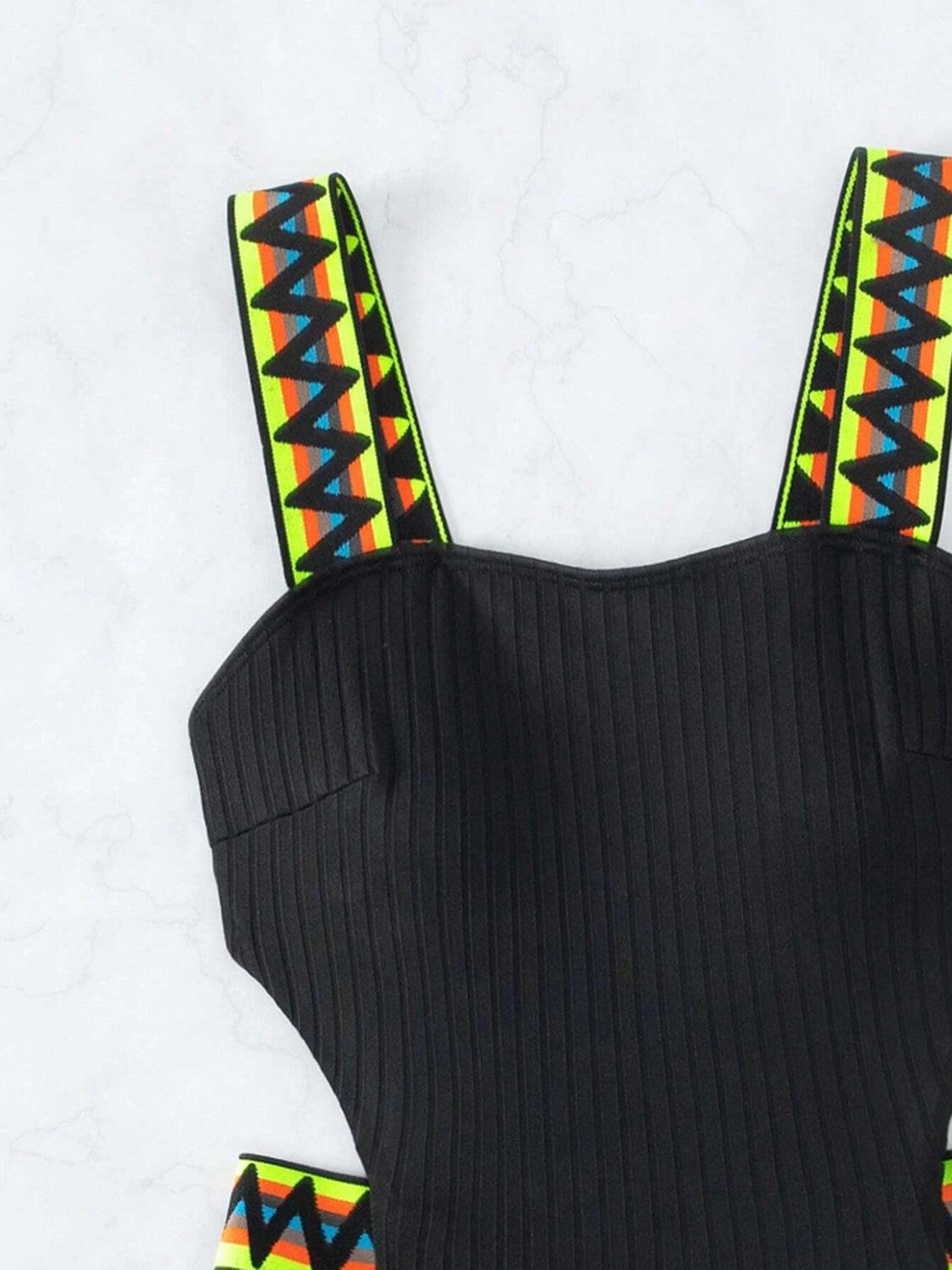 a black top with colorful straps on it