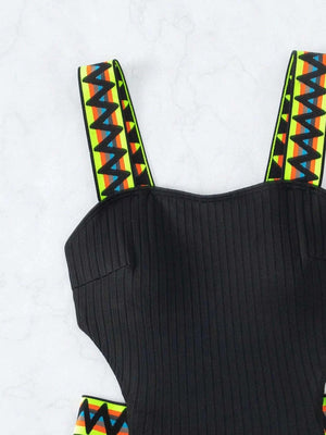 a black top with colorful straps on it