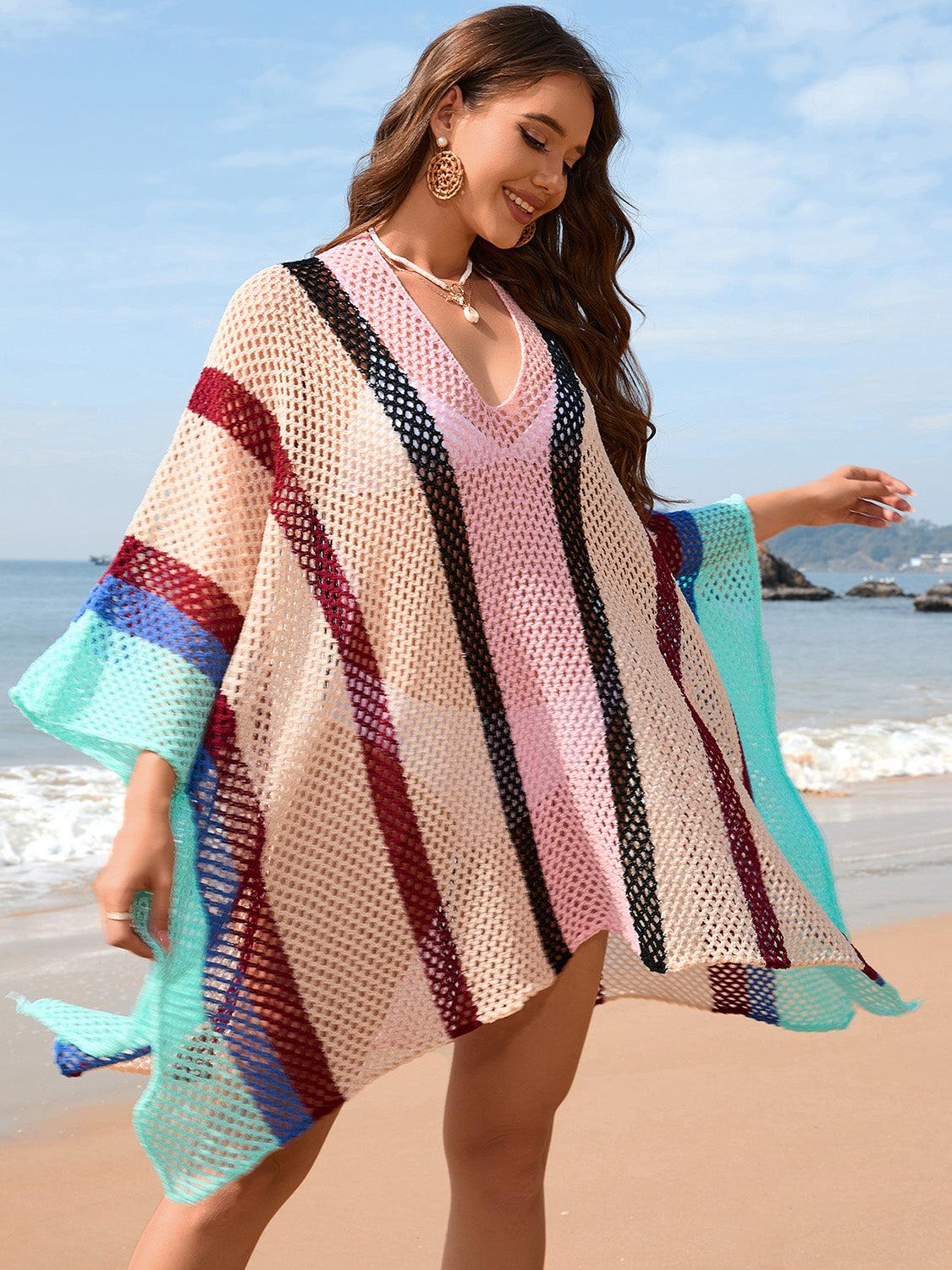 a woman standing on top of a sandy beach