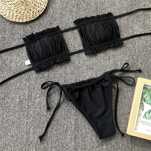 two pieces of black bikini with a straw hat