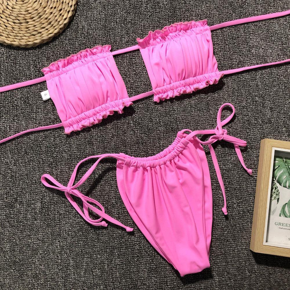 a woman's pink bikini top and matching panties