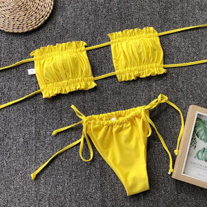 two pieces of yellow bikini with a picture frame