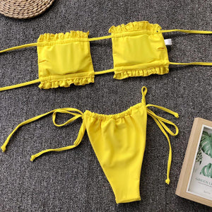 a woman's yellow bikini top and matching panties