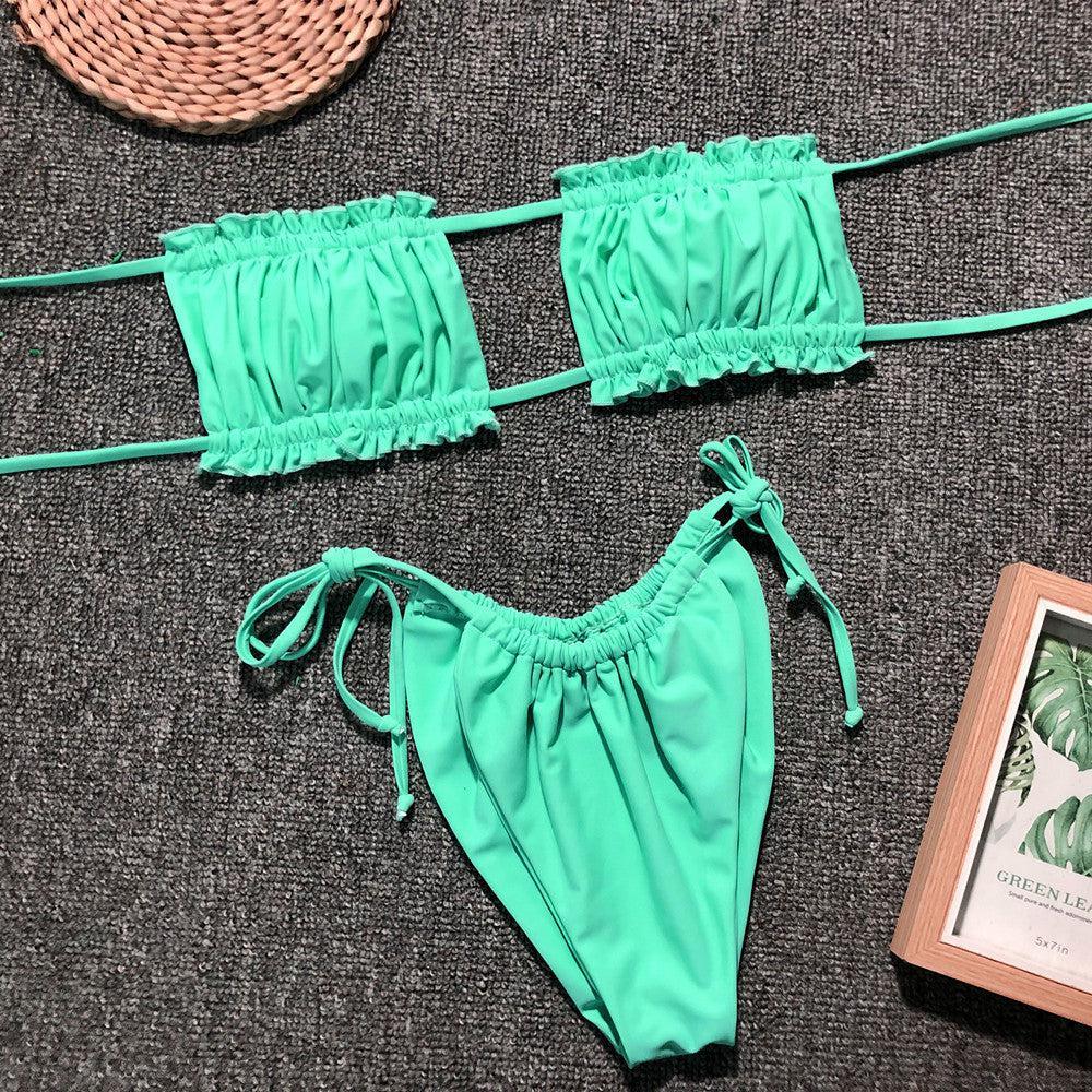 a woman's green bikini top and matching panties