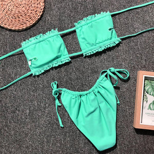 two pieces of green bikini with a picture frame