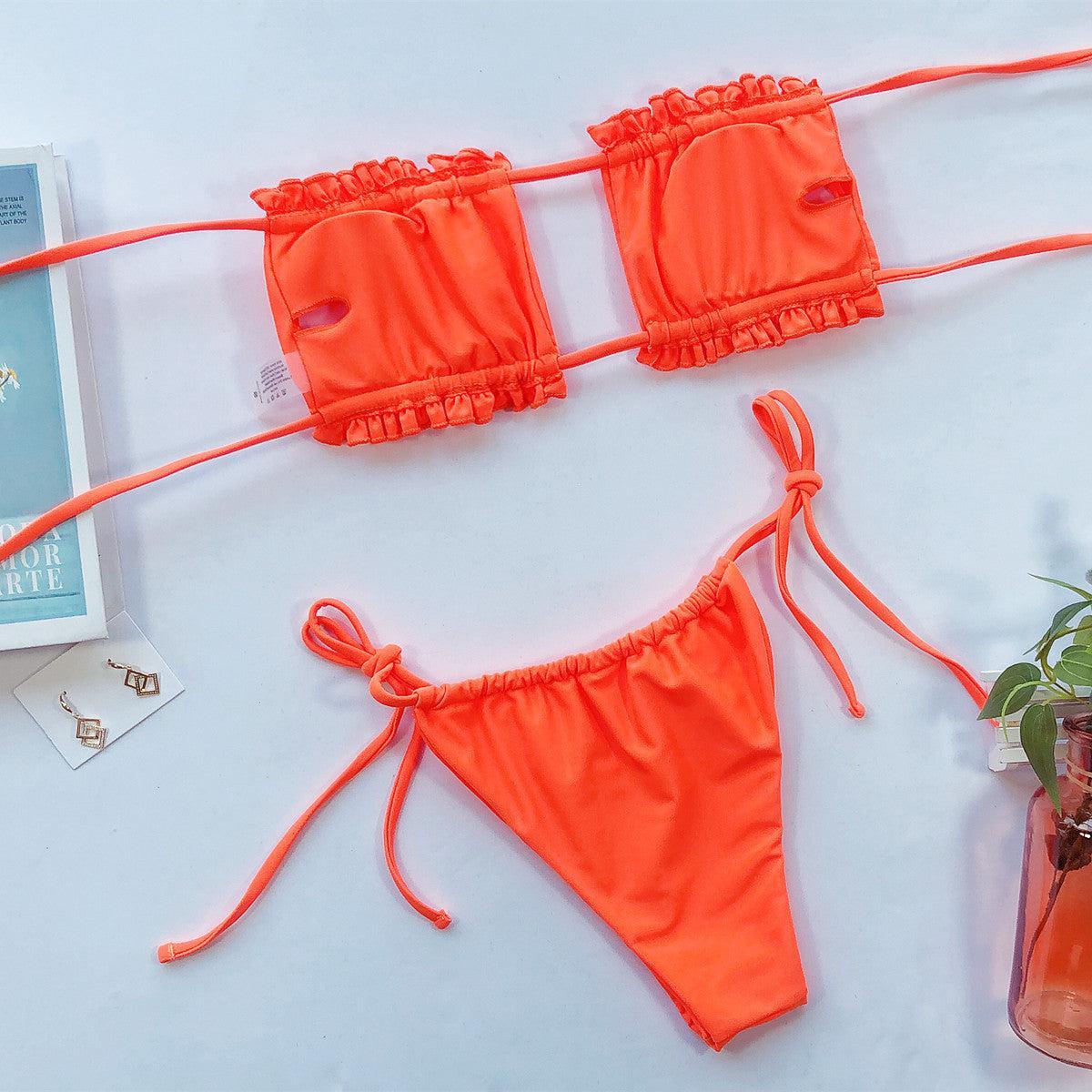 a pair of bikinis and a plant on a table