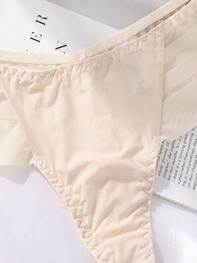 a pair of panties sitting on top of an open book