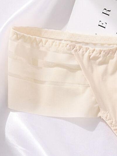 a close up of a pair of underwear on a bed