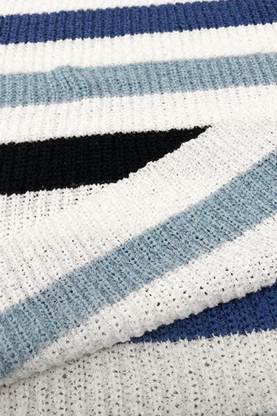 a close up of a knitted blanket on a bed