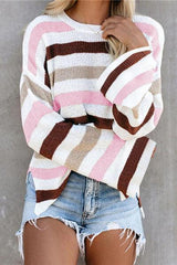 a woman wearing a pink and brown striped sweater