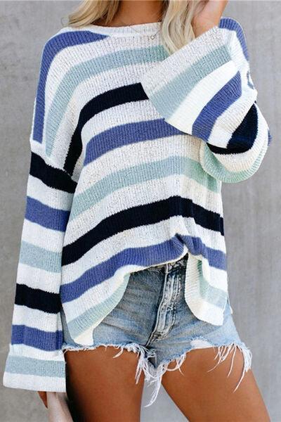 a woman wearing a blue and white striped sweater