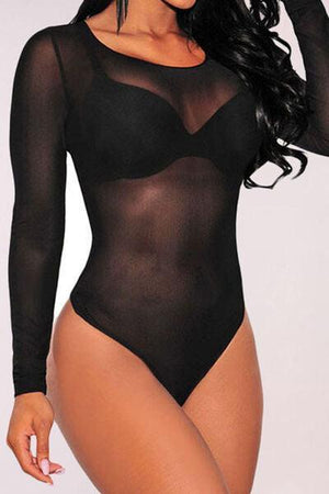 a woman in a black bodysuit posing for the camera