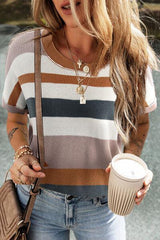 a woman holding a cup of coffee and a cell phone