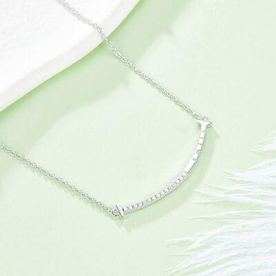 a silver necklace with a diamond bar on it