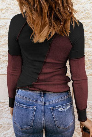 a woman in jeans and a black shirt