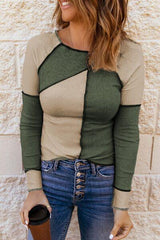 a woman wearing a green and tan top