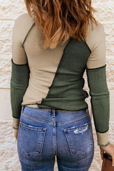 a woman in jeans and a sweater back view