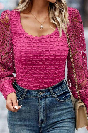 a woman wearing a pink top and jeans