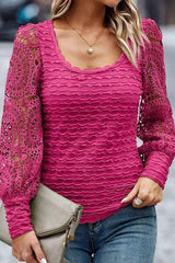 a woman wearing a pink top and jeans