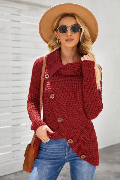 a woman wearing a red sweater and hat