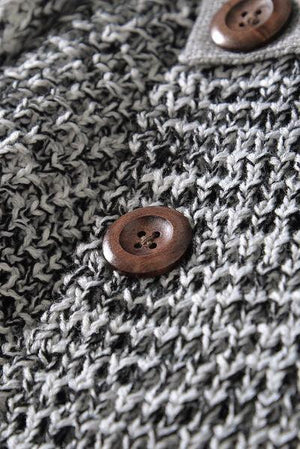 a close up of a button on a sweater
