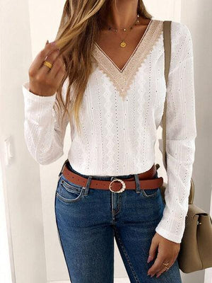 a woman wearing a white shirt and jeans