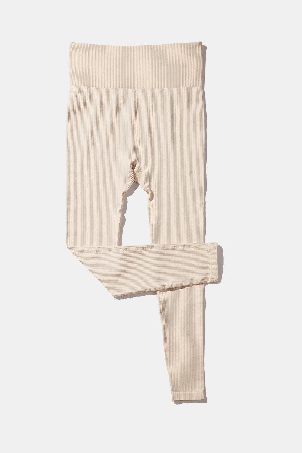 a pair of leggings on a white background